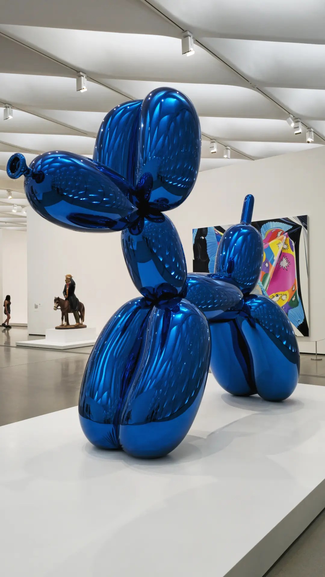 Close-up side angle of Jeff Koons' blue Balloon Dog sculpture at The Broad museum in Los Angeles, showcasing high-fidelity reflections and professional smartphone photography by MP Storytelling.